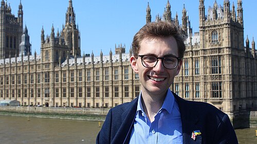 Photo of Jack Clark with Westminster in the background.